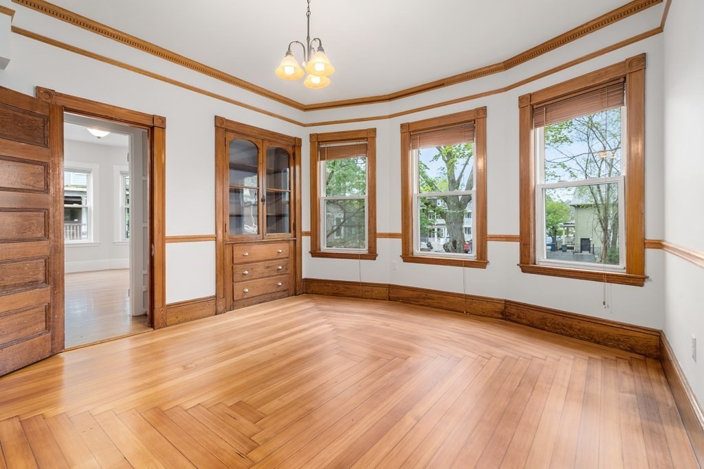 3 Adelaide Terrace, Unit 2 Boston, MA 02130 - Photo 1 of 16 a view of an empty room with a window and wooden floor