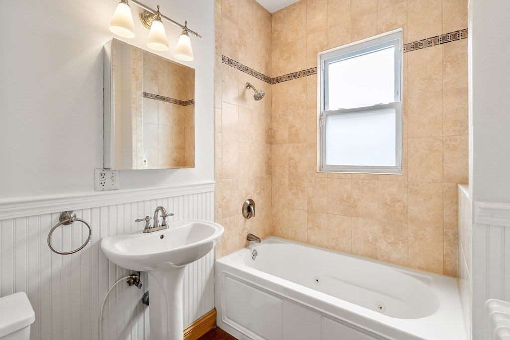 3 Adelaide Terrace, Unit 2 Boston, MA 02130 - Photo 11 of 16 a bathroom with a sink a toilet and shower