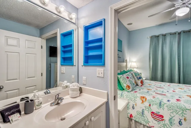 a bathroom with a sink and a mirror