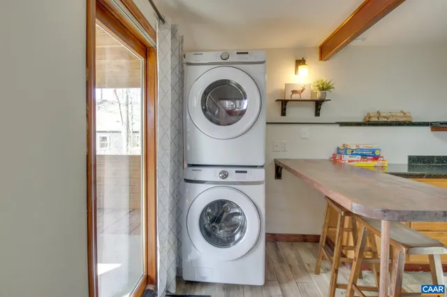a room with a window and a dresser