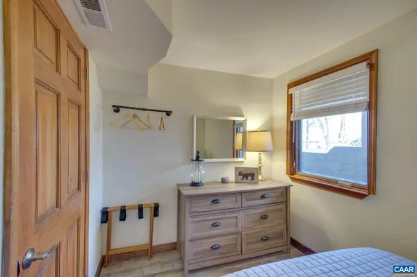 a bathroom with a sink a mirror and a window