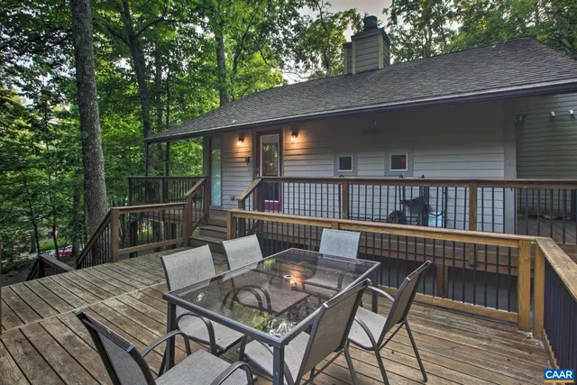 a view of a chair and tables in the balcony