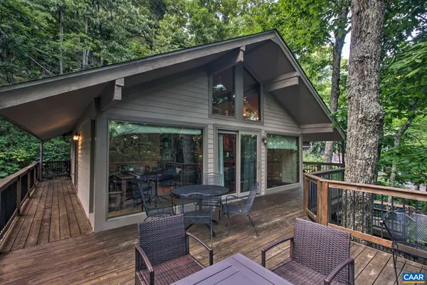 a view of a table and chairs on the roof deck