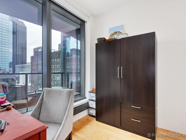 60 East Monroe Street, Unit 1906 Chicago, IL 60603 - Photo 18 of 20 a living room with furniture
