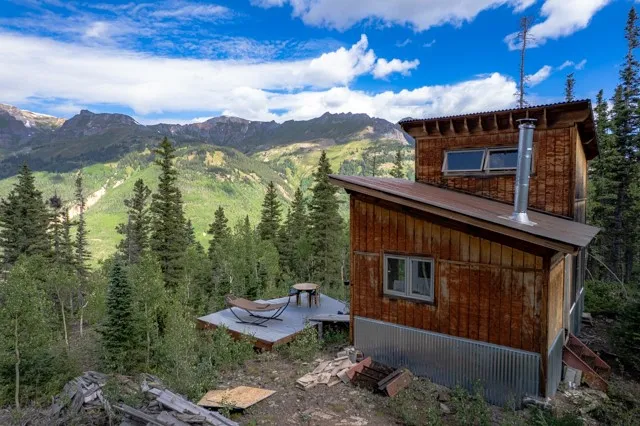 a backyard of a house with a fountain