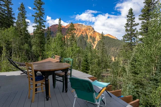 a view of a table and chairs on roof deck