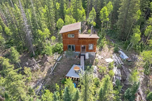 a aerial view of a house with a yard