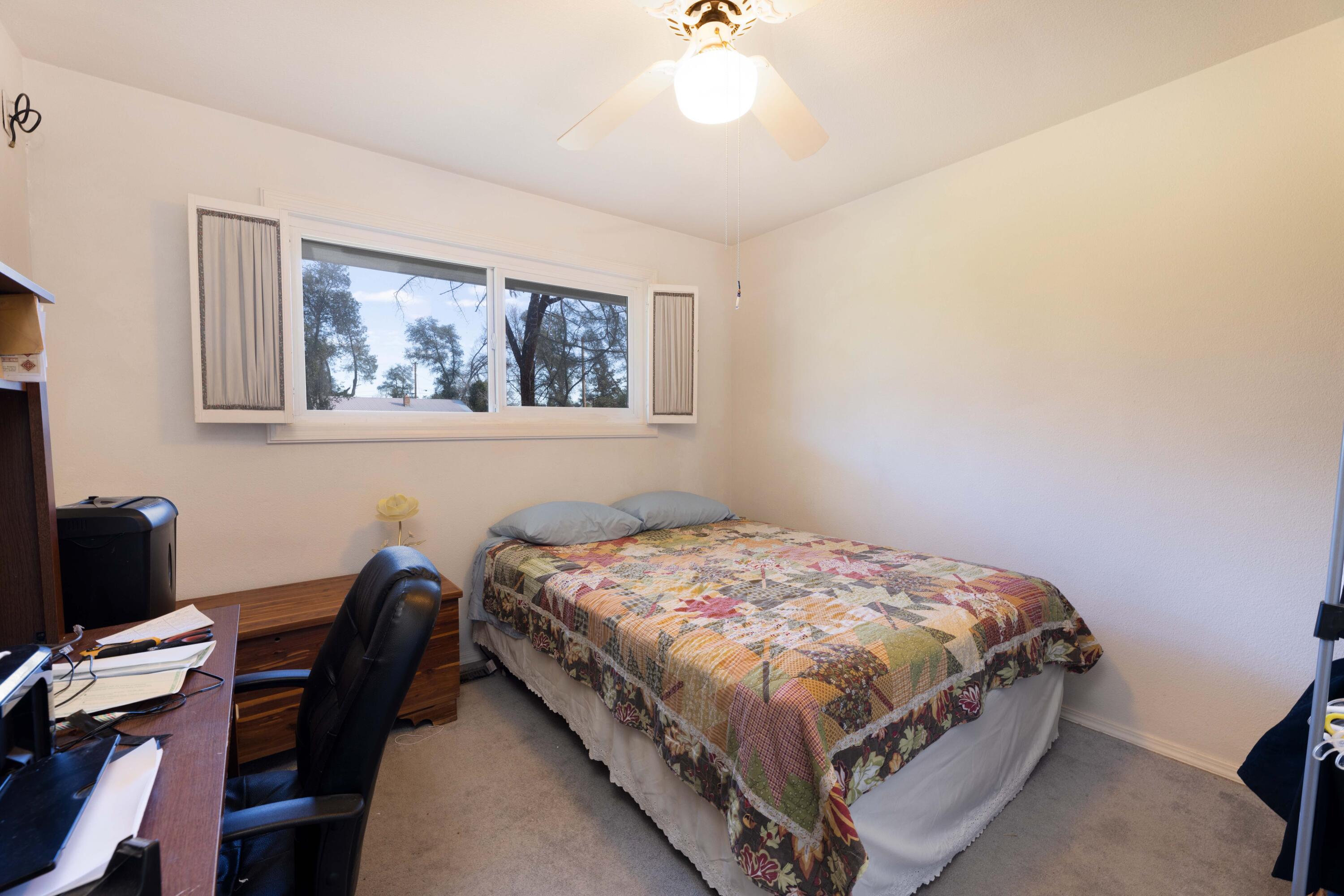 8790 Redbank Road Redding, CA 96001 - Photo 12 of 21 a bedroom with a bed and a desk