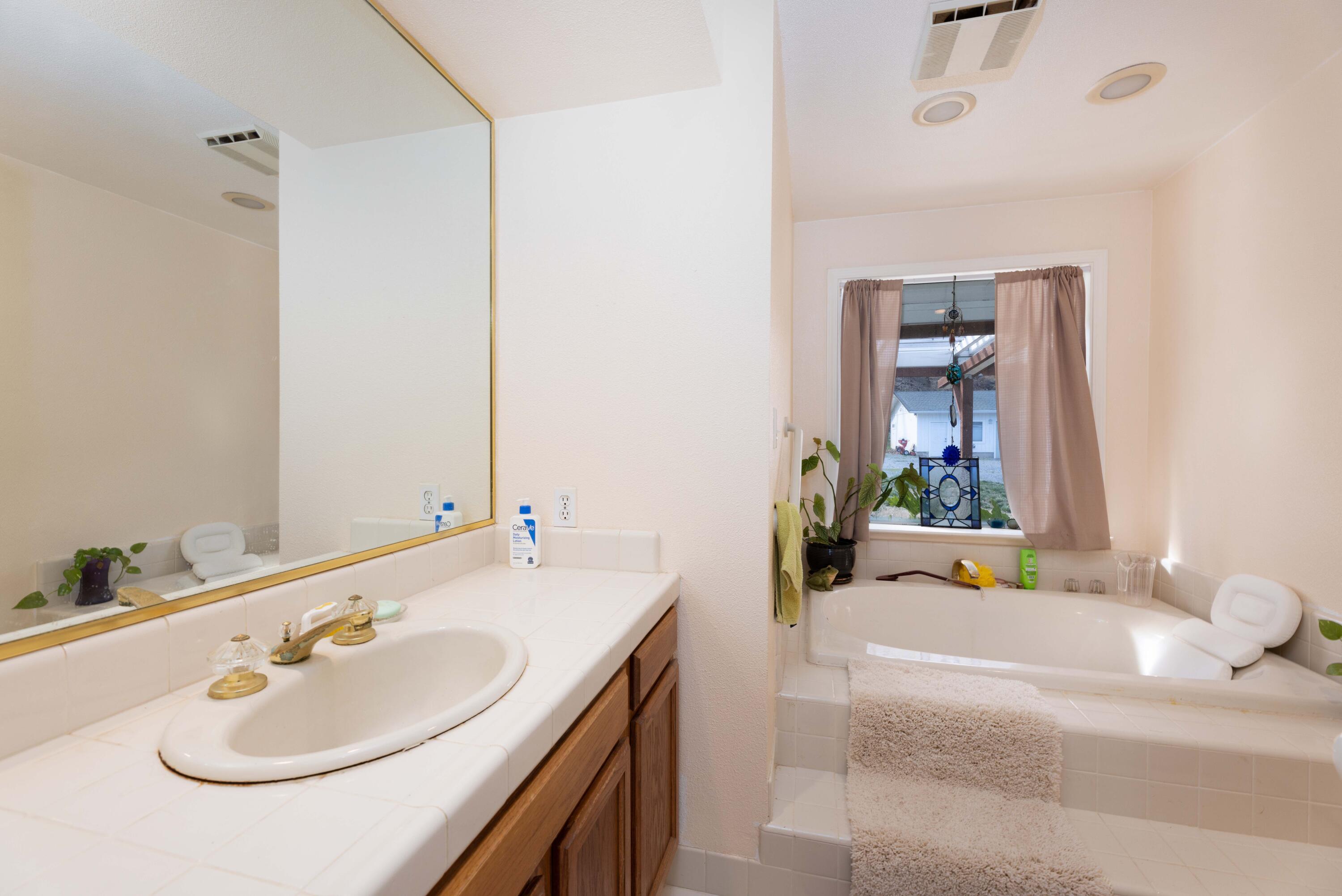 8790 Redbank Road Redding, CA 96001 - Photo 13 of 21 a bathroom with a sink and a mirror