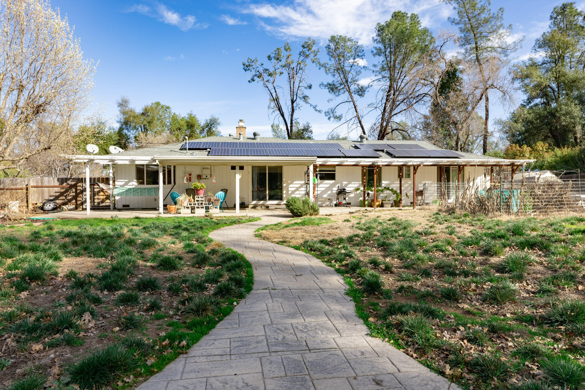 8790 Redbank Road Redding, CA 96001 - Photo 17 of 21 a view of a house with garden and trees