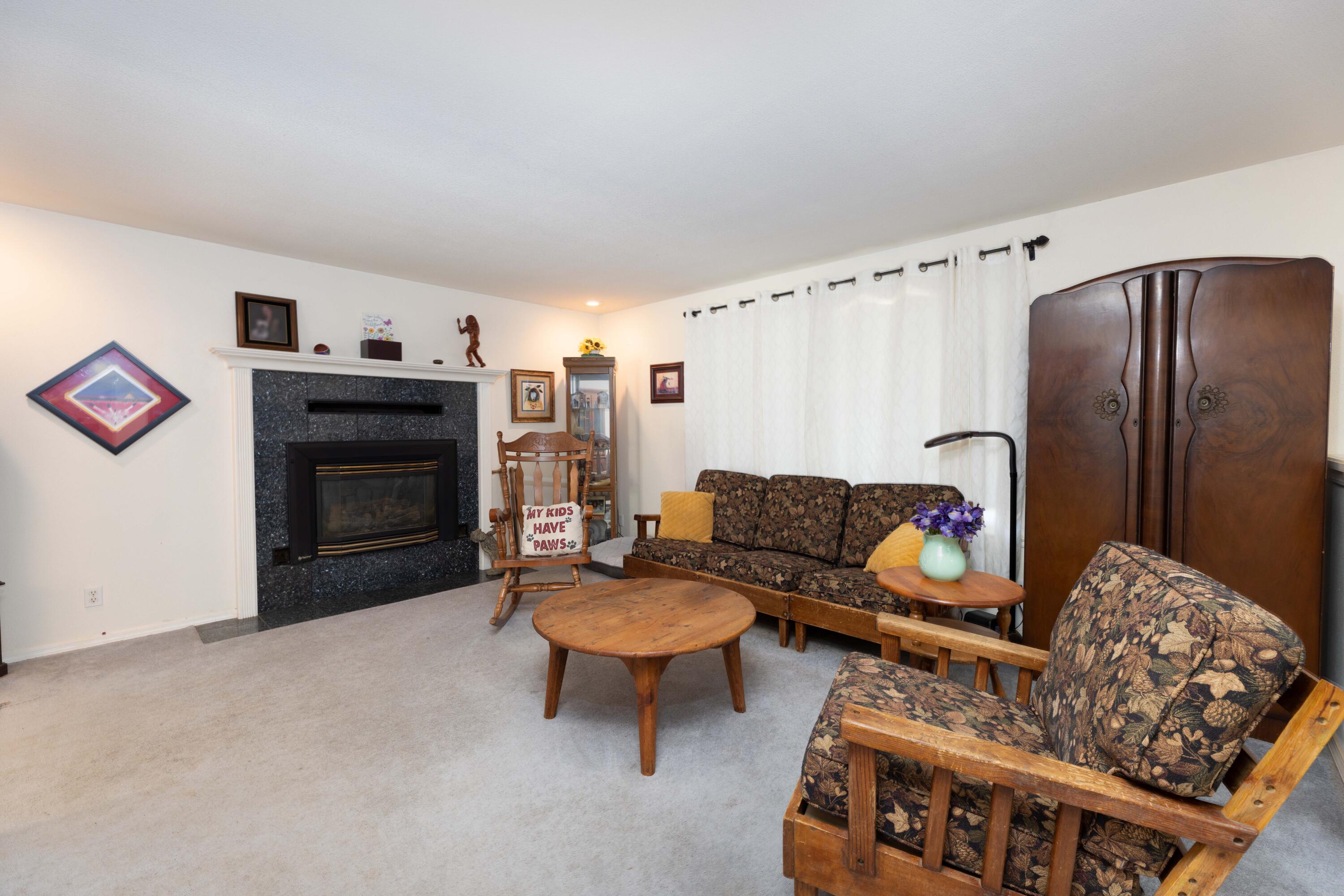 8790 Redbank Road Redding, CA 96001 - Photo 7 of 21 a living room with furniture and a fireplace