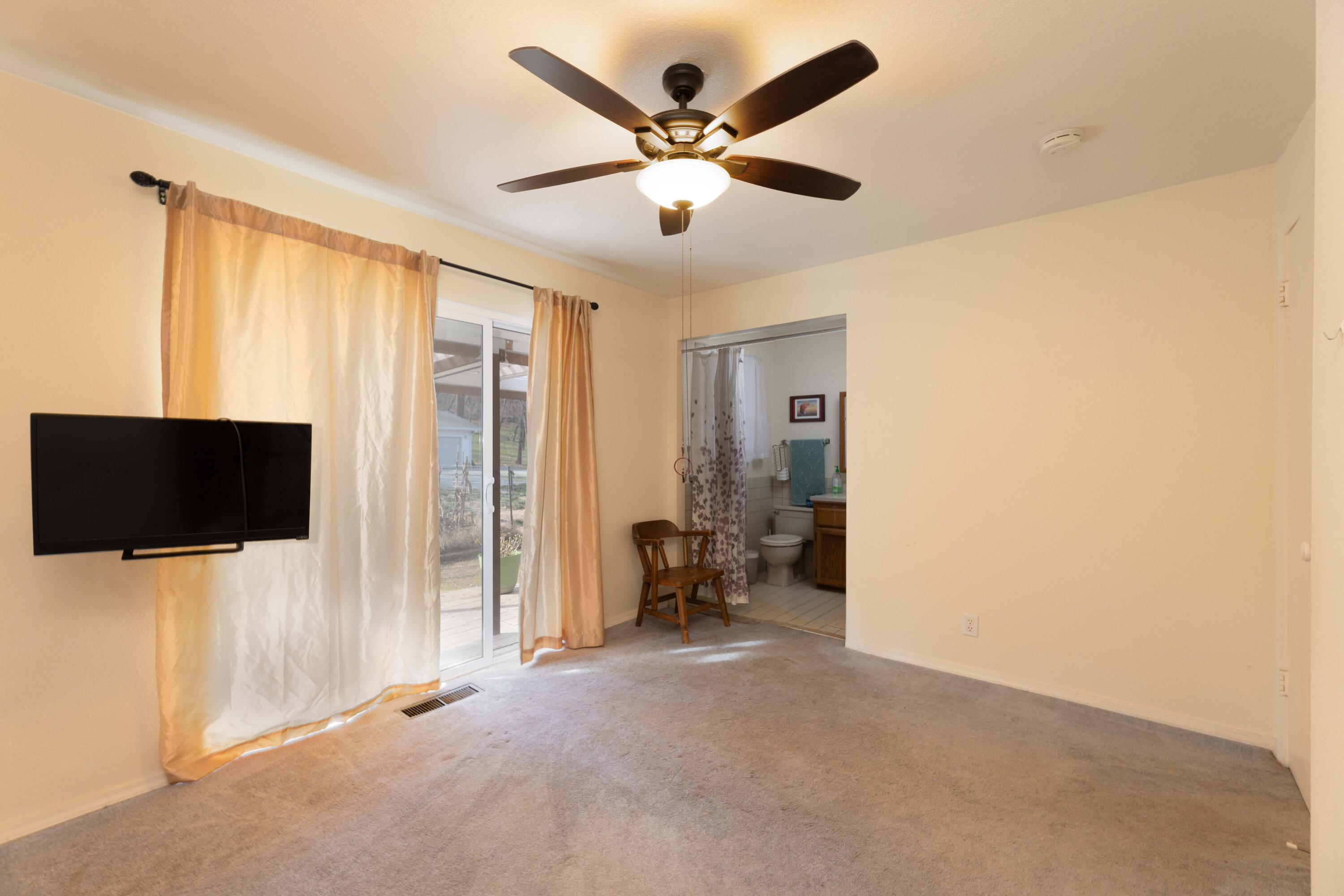 8790 Redbank Road Redding, CA 96001 - Photo 10 of 21 a view of livingroom with furniture and a flat screen tv