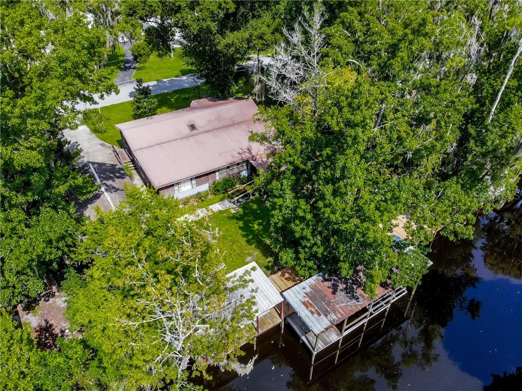 56310 Elm Road Astor, FL 32102 - Photo 1 of 1 an aerial view of a house with a yard