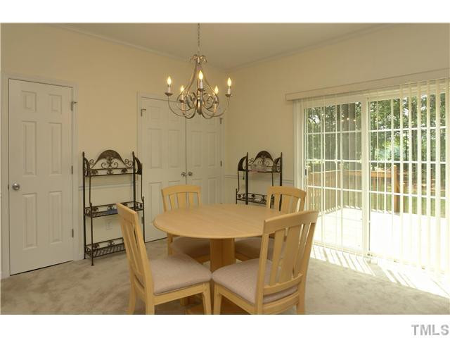119 West Quail Ridge Road Oxford, NC 27565 - Photo 9 of 21 Another view of the dining room looking outside. The door to the left is a half bath. The double doors open to extra large pantry or can be converted back to LAUNDRY area by adding plumbing for washer & dryer. Dining Room