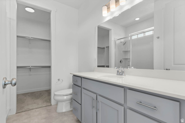 3204 West 1570 North Provo, UT 84601 - Photo 17 of 19 Full bath with a spacious closet, a stall shower, vanity, and recessed lighting