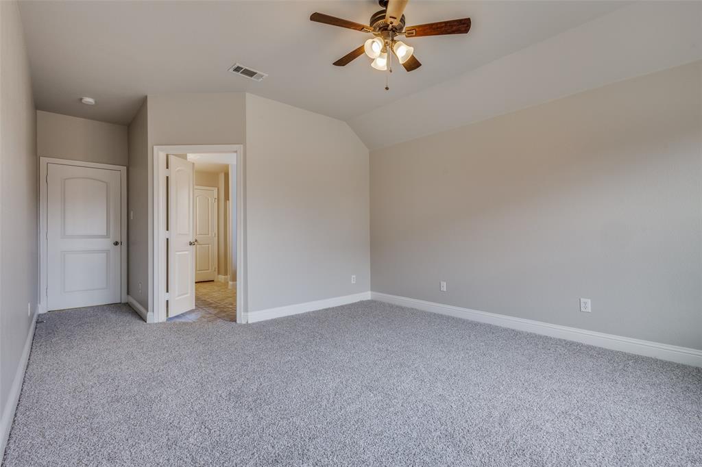 145 Mill Street Anna, TX 75409 - Photo 15 of 25 a view of an empty room and chandelier fan