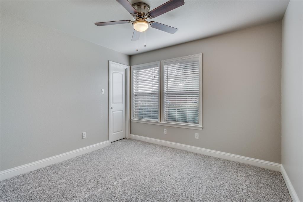 145 Mill Street Anna, TX 75409 - Photo 18 of 25 an empty room with windows and fan