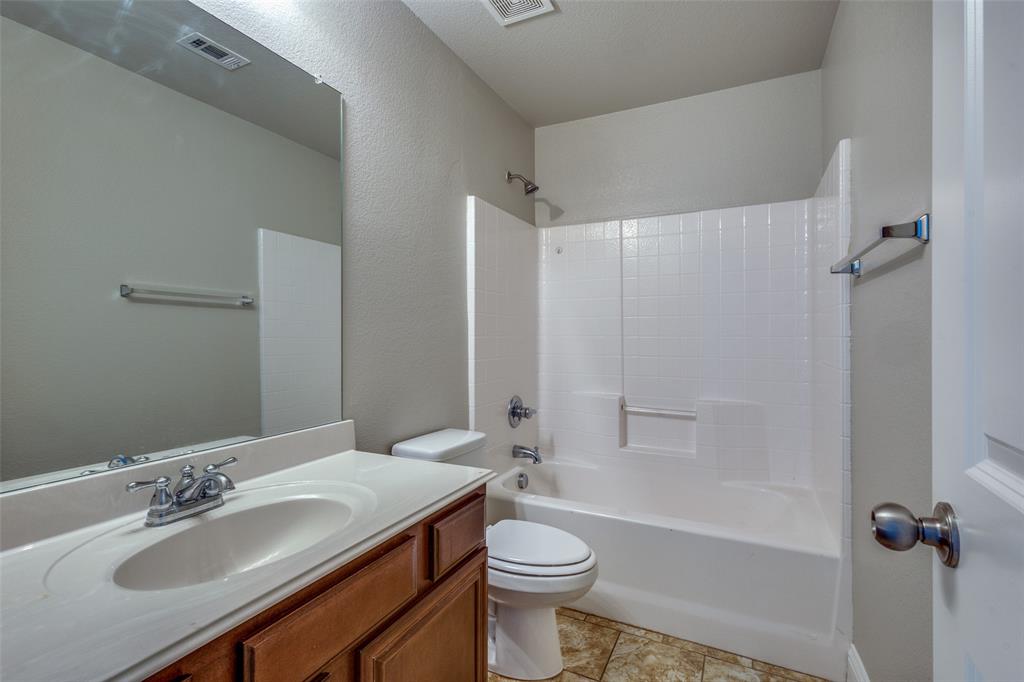 145 Mill Street Anna, TX 75409 - Photo 19 of 25 a bathroom with a sink toilet tub and shower