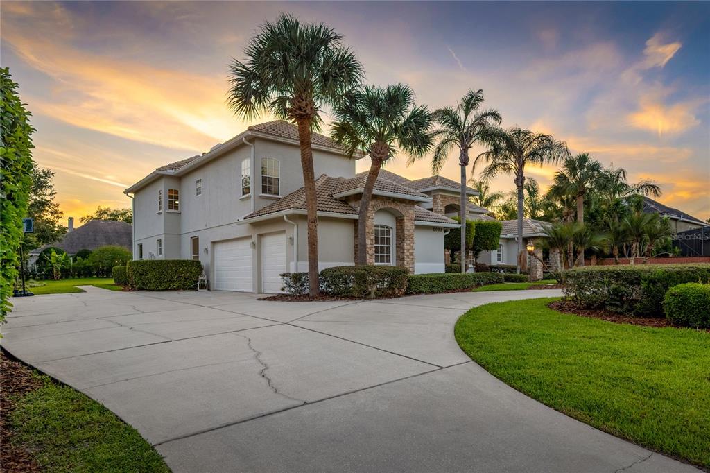 2002 Water Key Drive Windermere, FL 34786 - Photo 56 of 60 a front view of a house with a garden