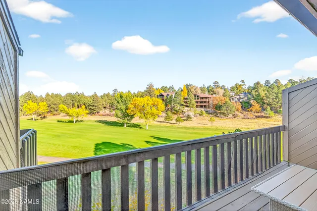 a bedroom with two beds and a window