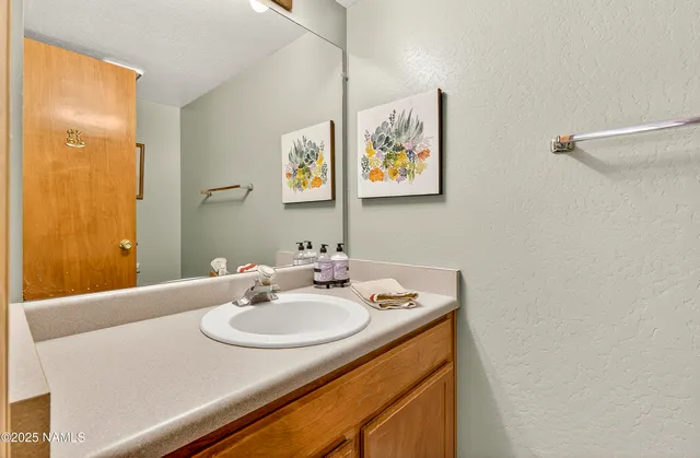 a bedroom with two beds and a window