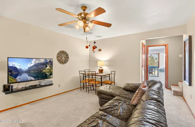 a bedroom with furniture and a lamp