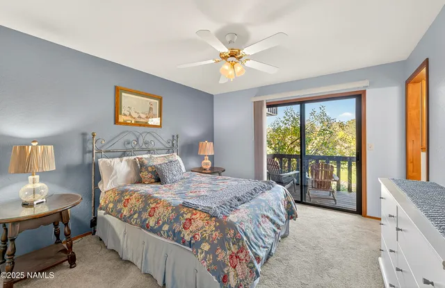 a view of a yard with wooden fence and trees