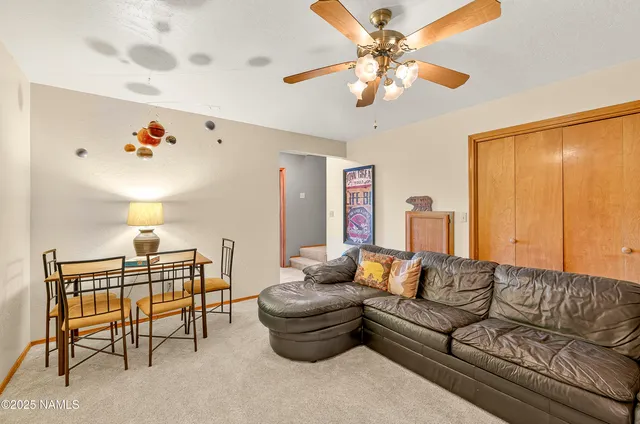 a bedroom with furniture and a lamp