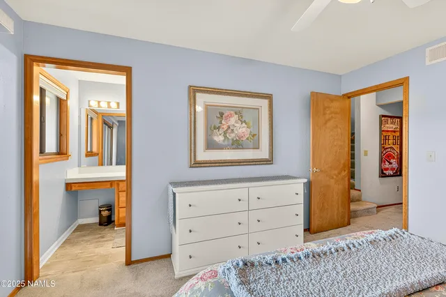 a view of a balcony with a yard