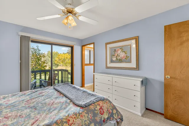 a view of a balcony with a yard