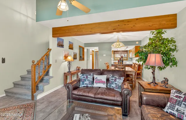 a view of a dining room with furniture wooden floor and chandelier