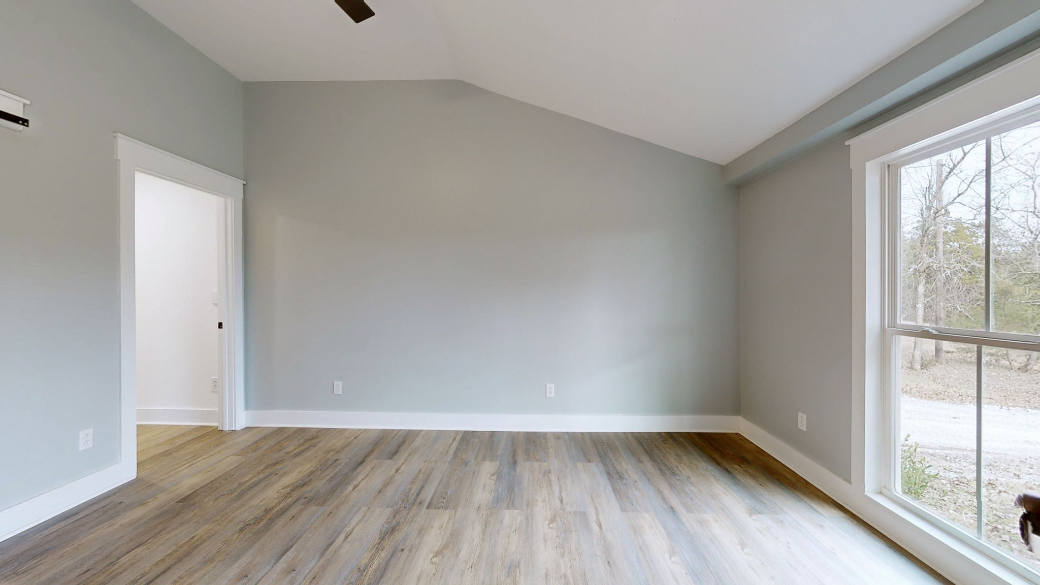 94 Bond Road Lebanon, TN 37090 - Photo 18 of 32 a view of an empty room with wooden floor and a window