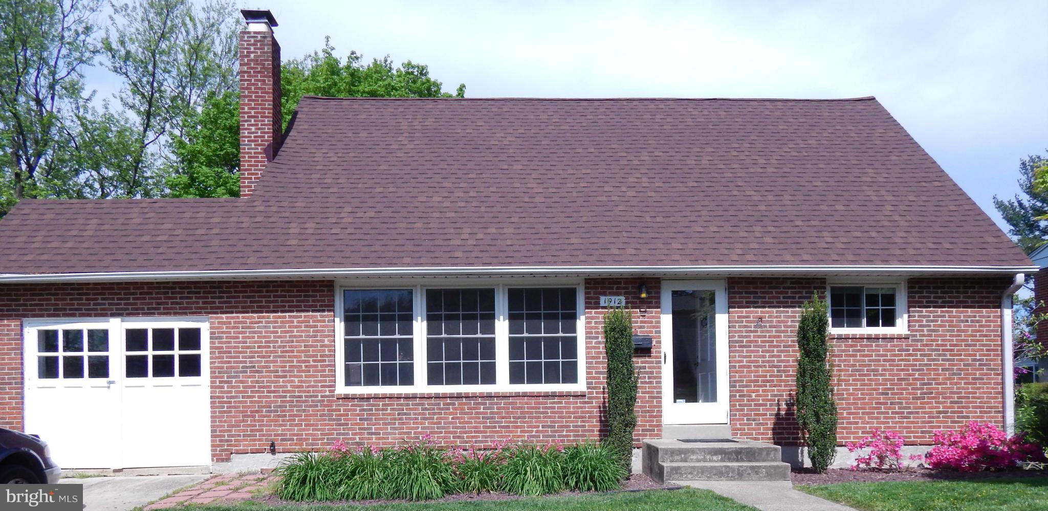 1912 Tadcaster Road Catonsville, MD 21228 - Photo 2 of 26 a house that has a tree in front of it