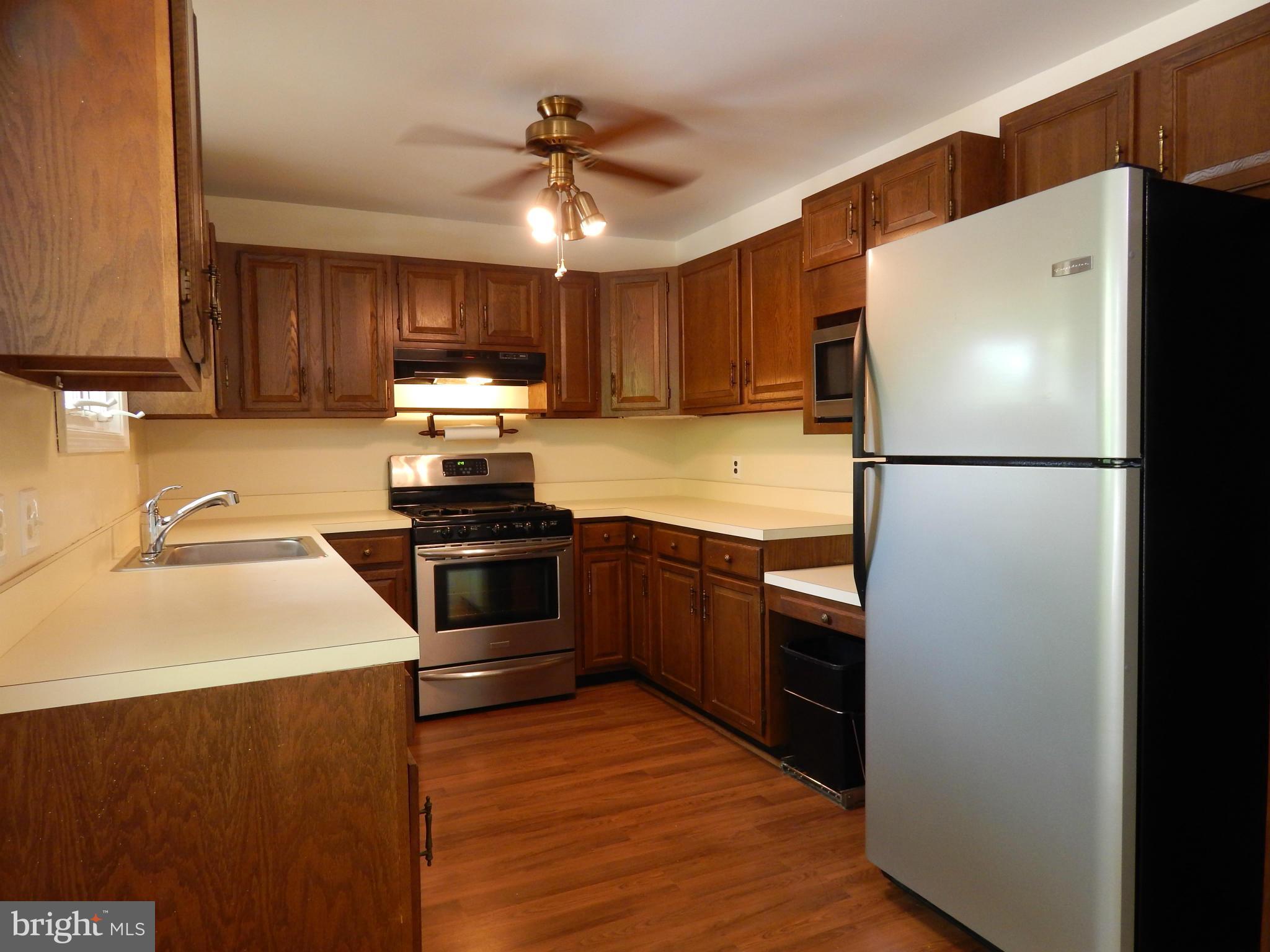 1912 Tadcaster Road Catonsville, MD 21228 - Photo 13 of 26 a kitchen with a refrigerator and a sink