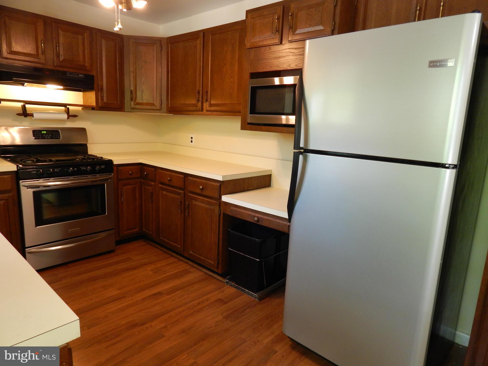 1912 Tadcaster Road Catonsville, MD 21228 - Photo 16 of 26 a kitchen with a refrigerator sink and stove top oven