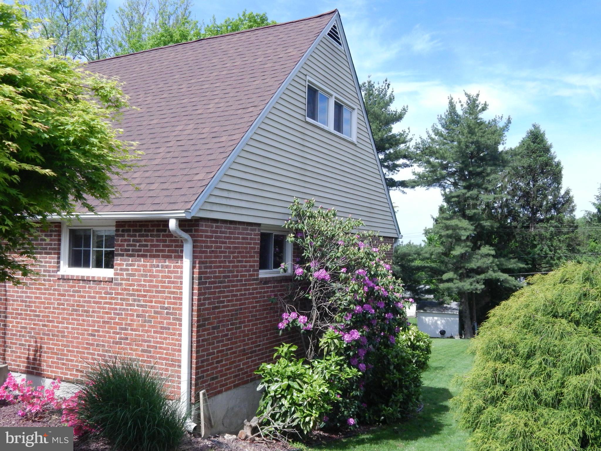 1912 Tadcaster Road Catonsville, MD 21228 - Photo 25 of 26 a view of a house with a yard and potted plants