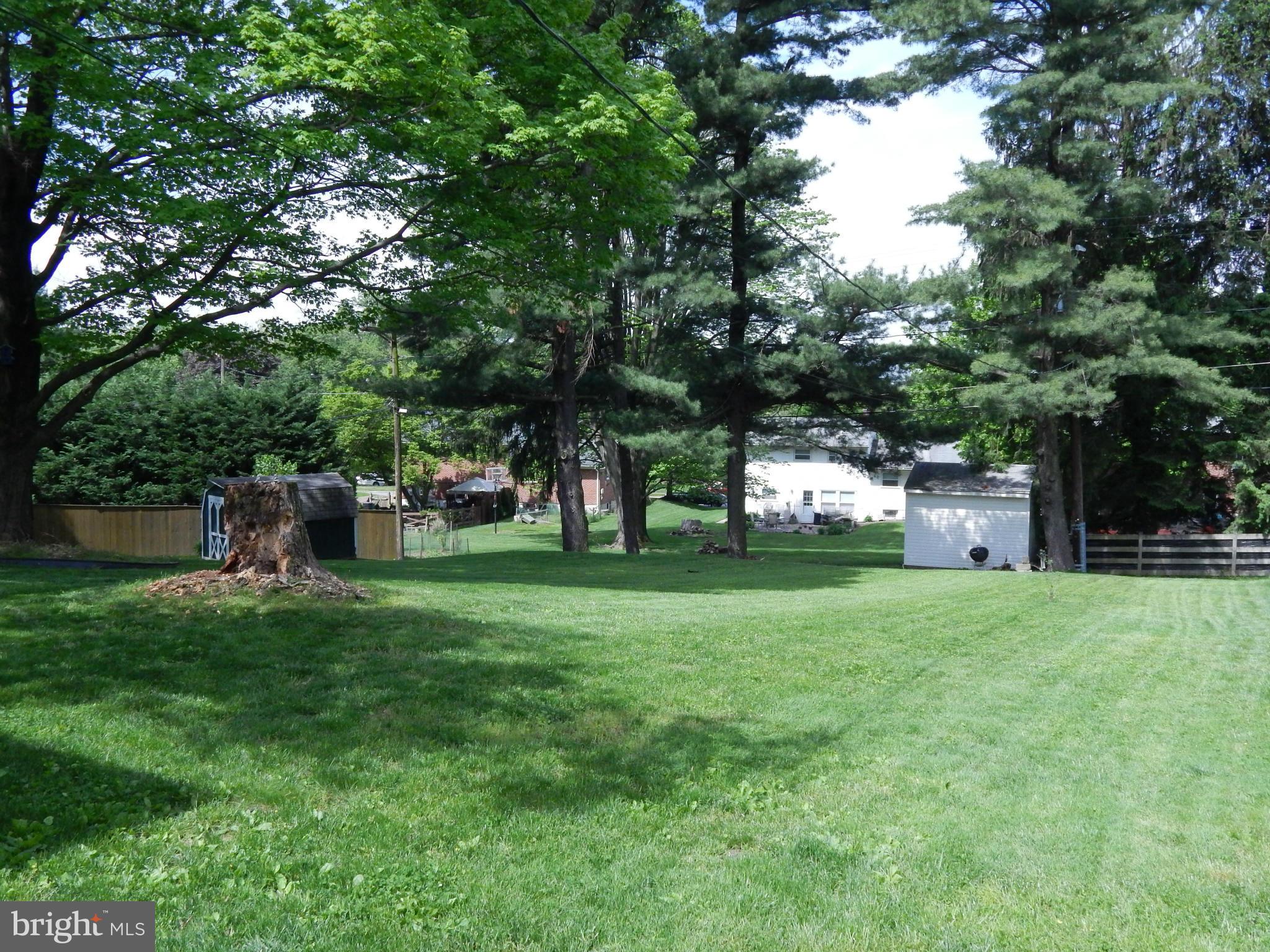 1912 Tadcaster Road Catonsville, MD 21228 - Photo 26 of 26 a front view of a house with a yard and trees