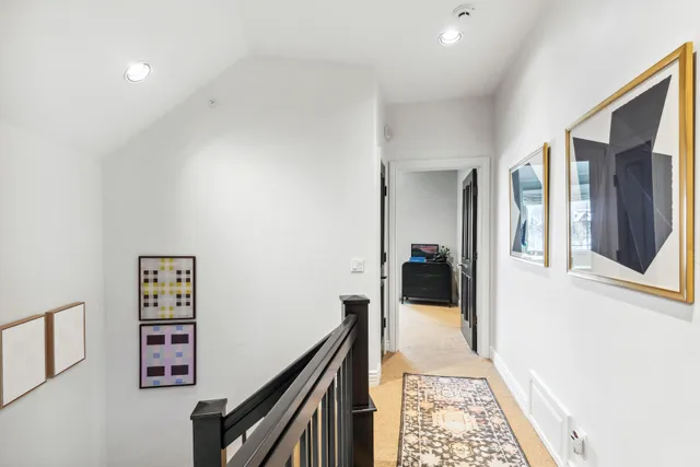 a view of a hallway view with staircase