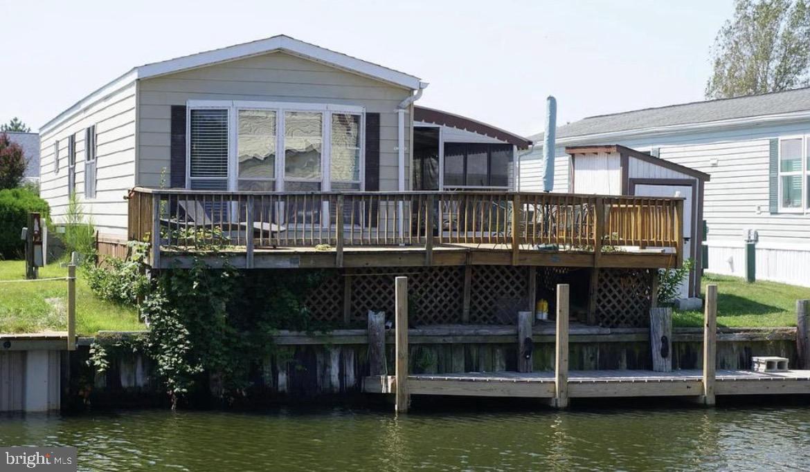 a view of a large building next to a lake