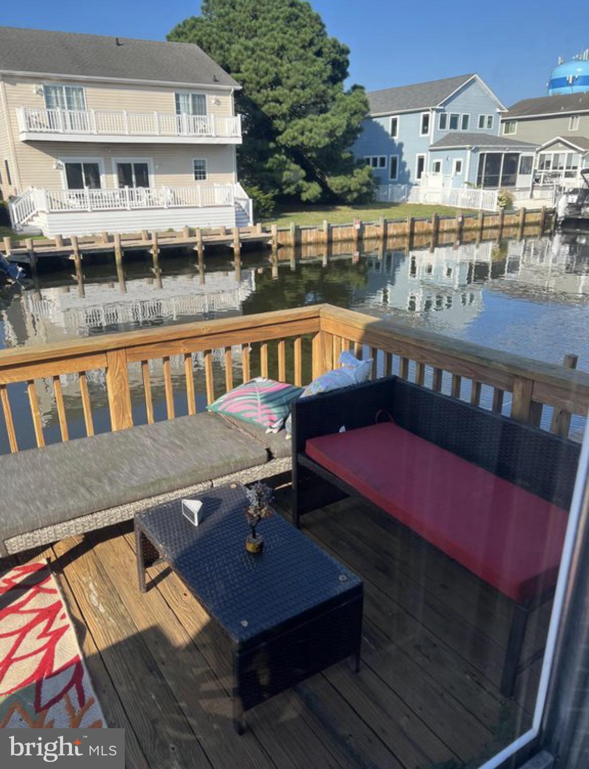 142 Peachtree Road Ocean City, MD 21842 - Photo 2 of 14 a view of a balcony with two chairs and a table