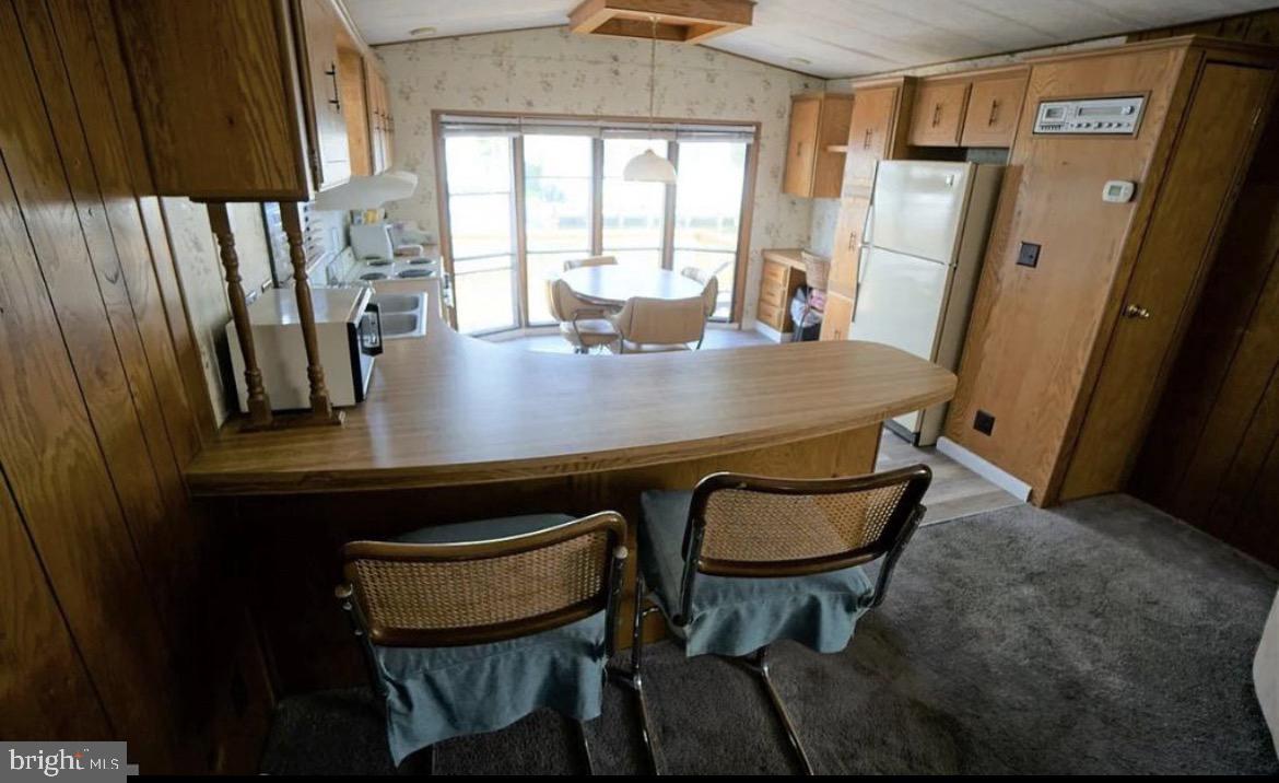 142 Peachtree Road Ocean City, MD 21842 - Photo 8 of 14 a view of a dining room with furniture and window