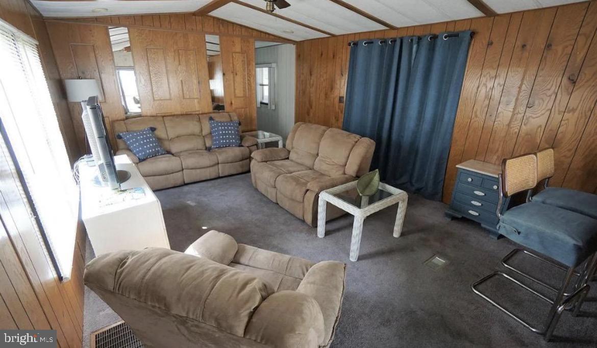 142 Peachtree Road Ocean City, MD 21842 - Photo 9 of 14 a living room with furniture and a window