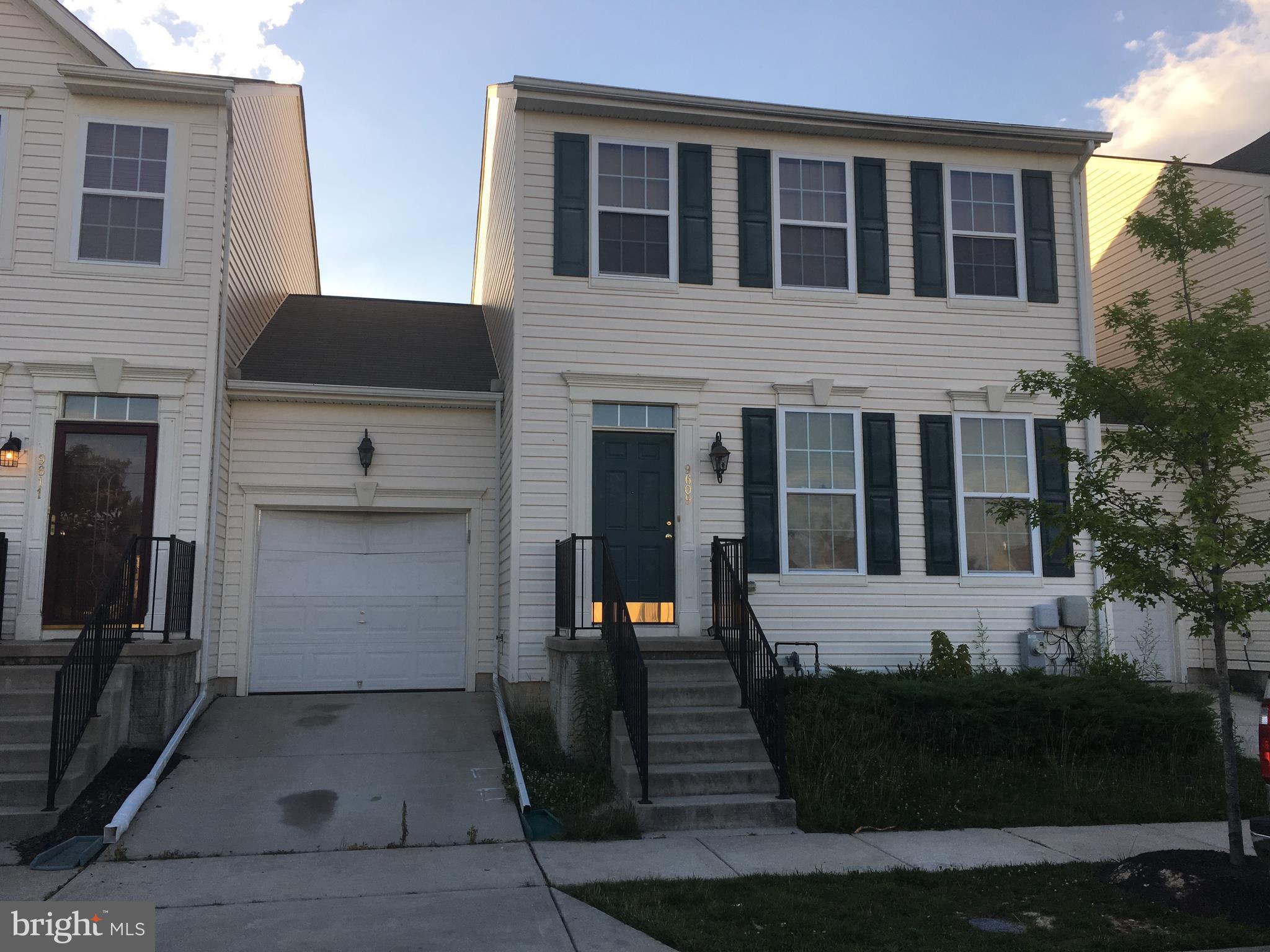 9609 Davison Road Baltimore, MD 21220 - Photo 1 of 21 a front view of a house with a yard