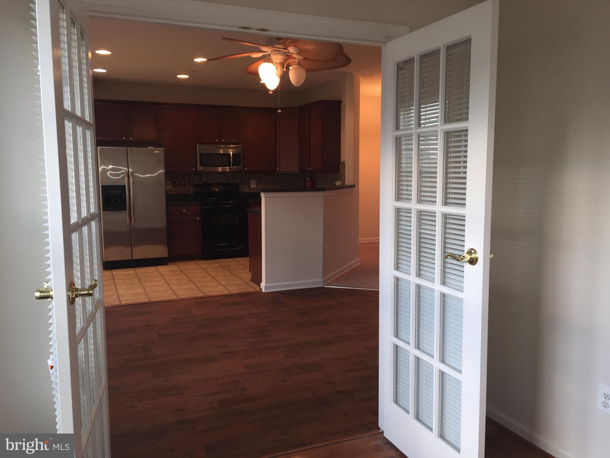 9609 Davison Road Baltimore, MD 21220 - Photo 7 of 21 a view of kitchen with refrigerator and window