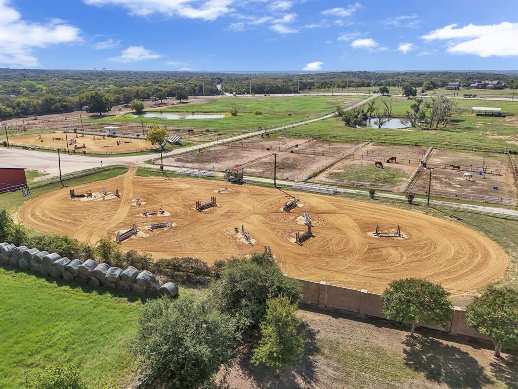 7950 Cross Timbers Road Flower Mound, TX 75022 - Photo 26 of 37 an aerial view of a house with a yard lake and outdoor space