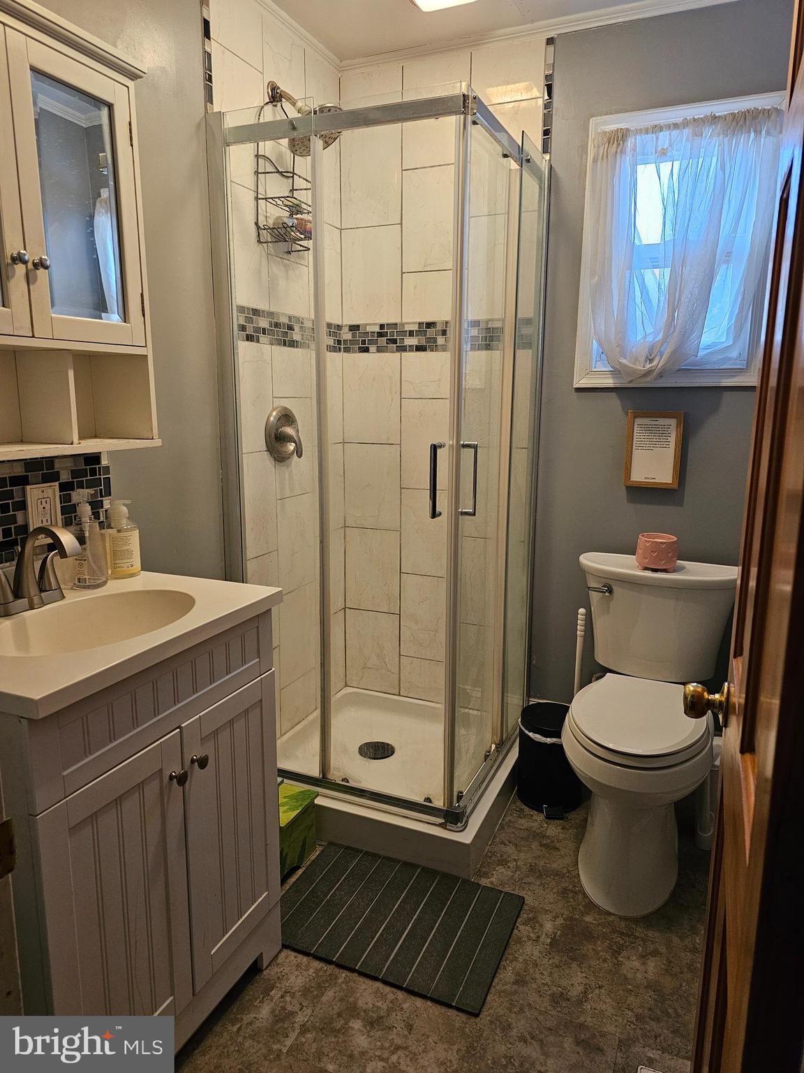 57 Union Street Pennsville, NJ 08070 - Photo 14 of 24 a bathroom with a sink toilet and shower