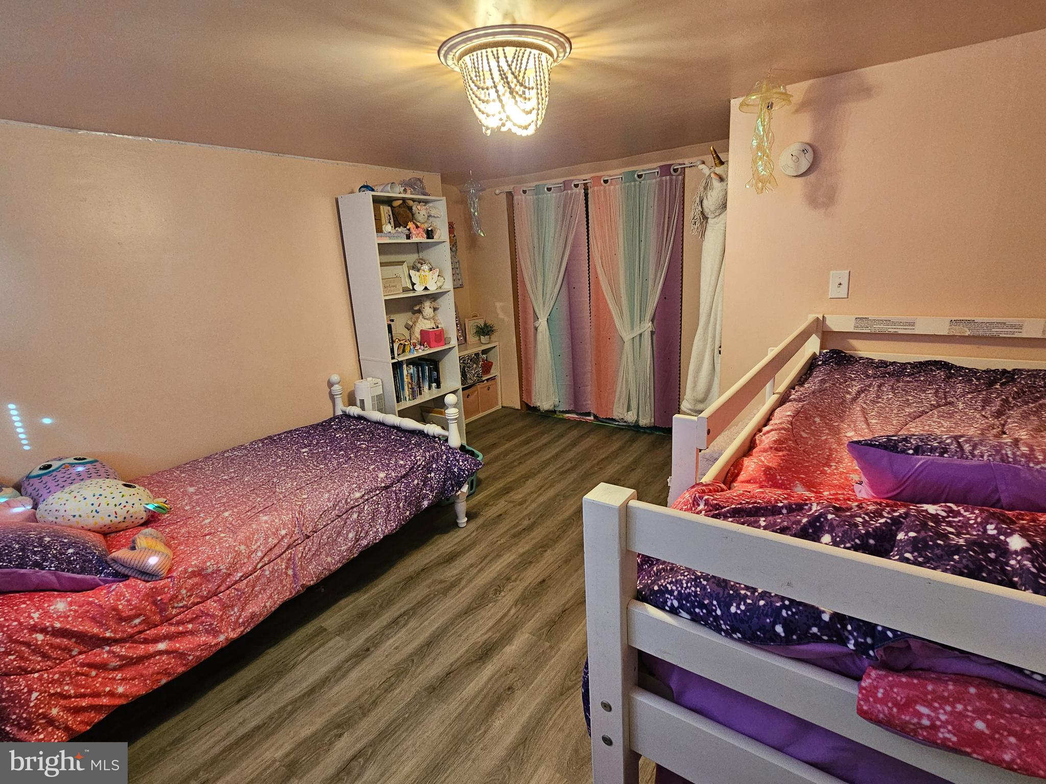 57 Union Street Pennsville, NJ 08070 - Photo 18 of 24 a bedroom with a bed and a book shelf