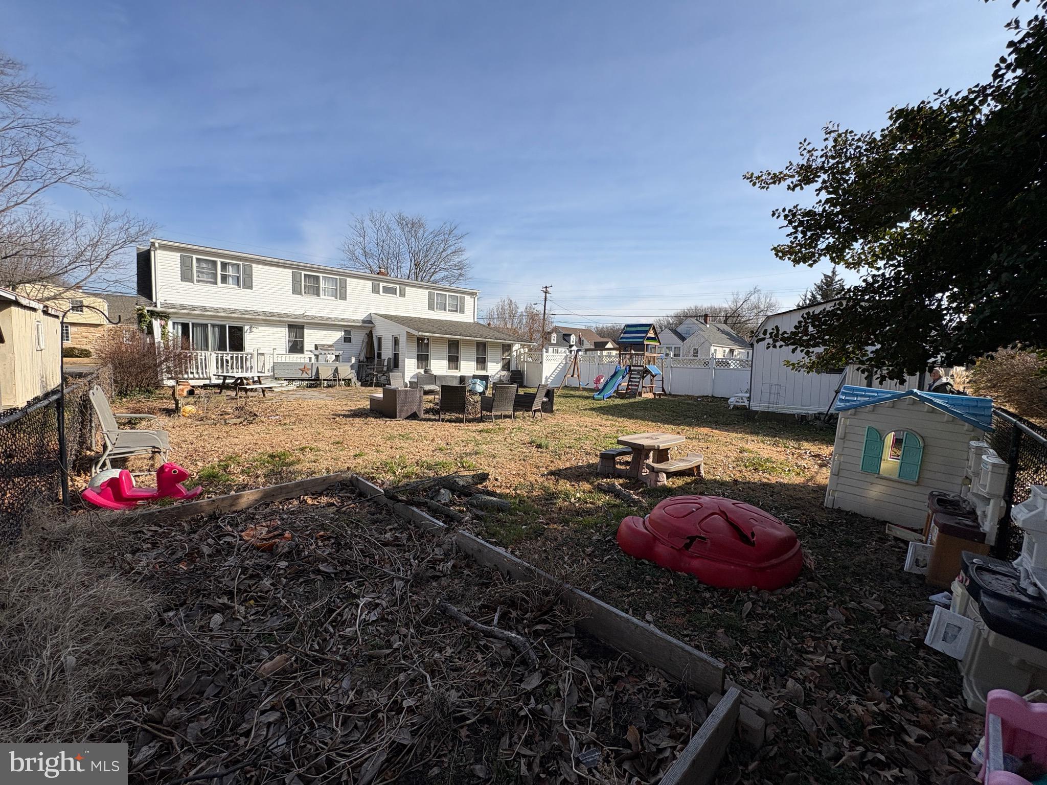 57 Union Street Pennsville, NJ 08070 - Photo 20 of 24 a backyard of a house with barbeque oven table and chairs