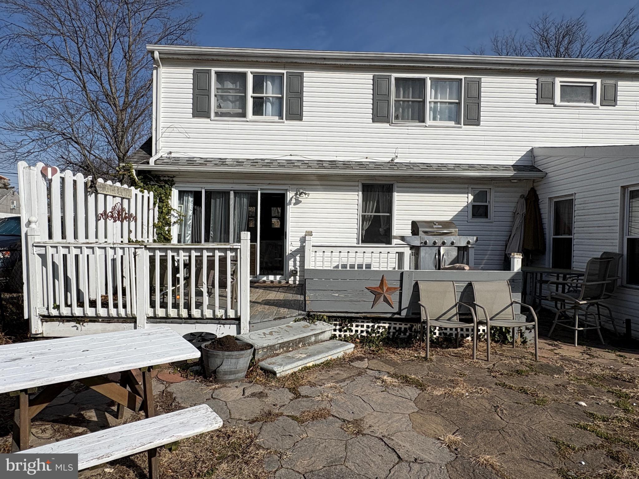 57 Union Street Pennsville, NJ 08070 - Photo 21 of 24 a view of a patio with table and chairs and wooden fence