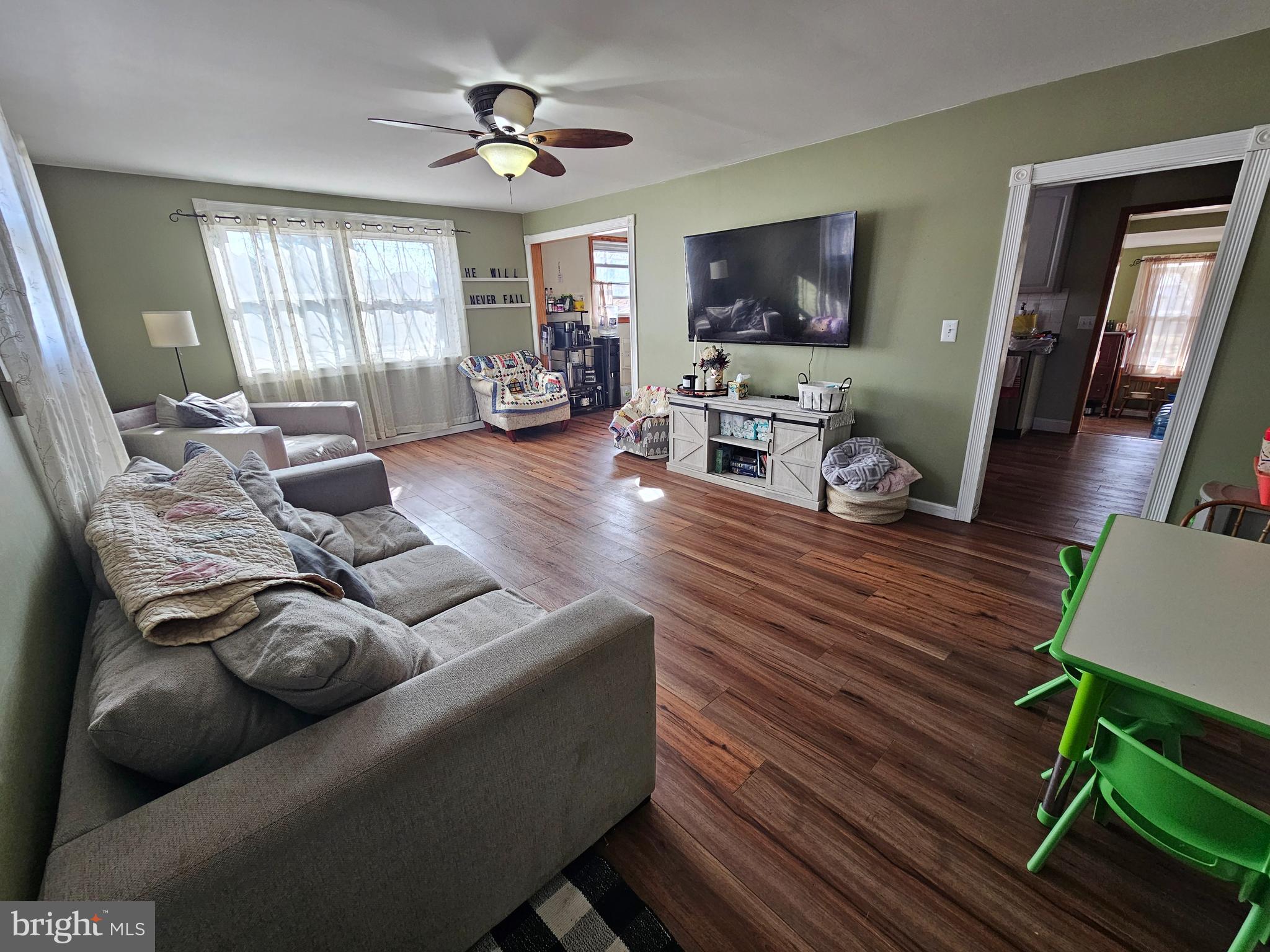 57 Union Street Pennsville, NJ 08070 - Photo 4 of 24 a living room with furniture flat screen tv and wooden floor